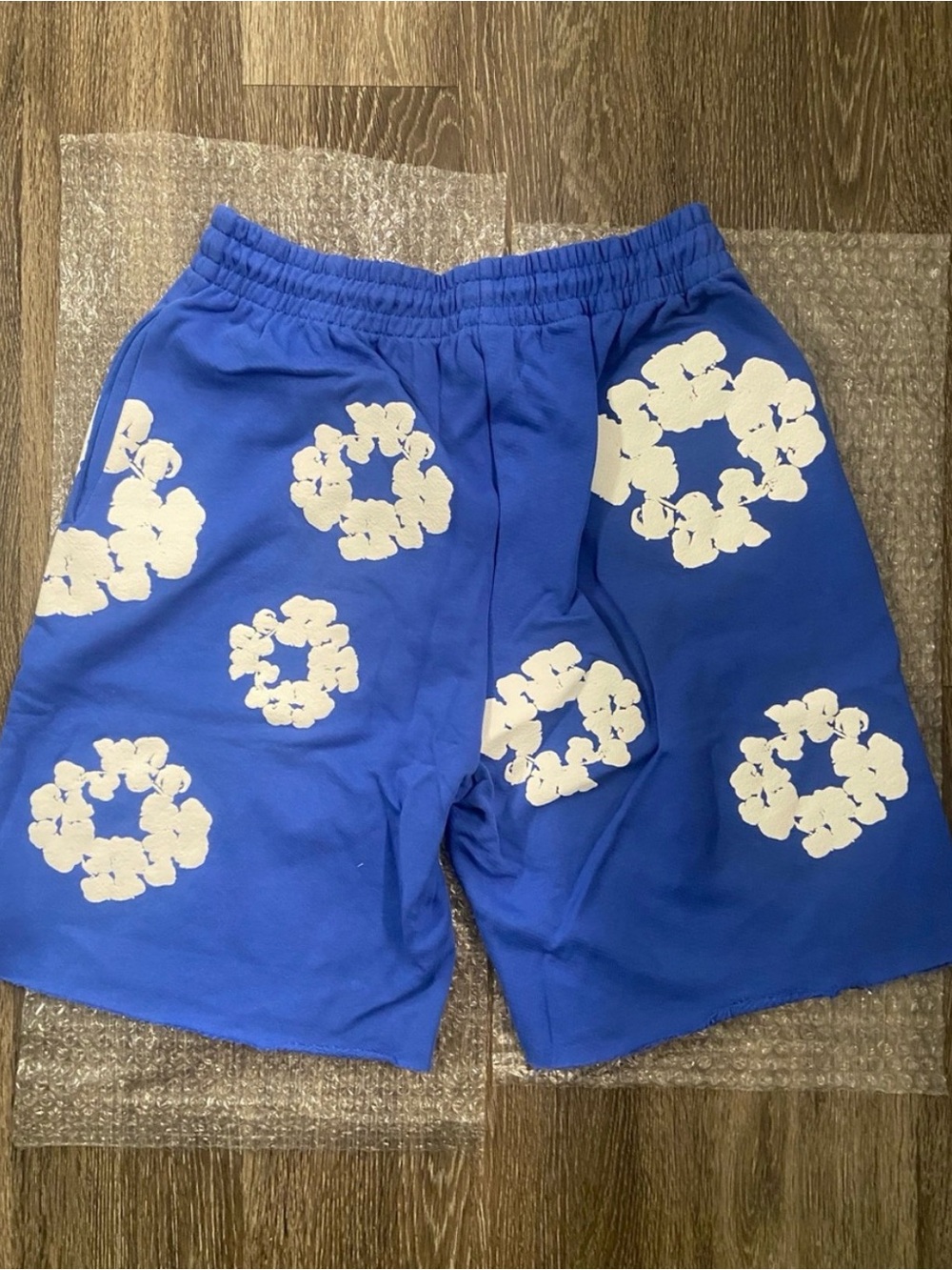 Blue Athletic Shorts with White Floral Ring Print